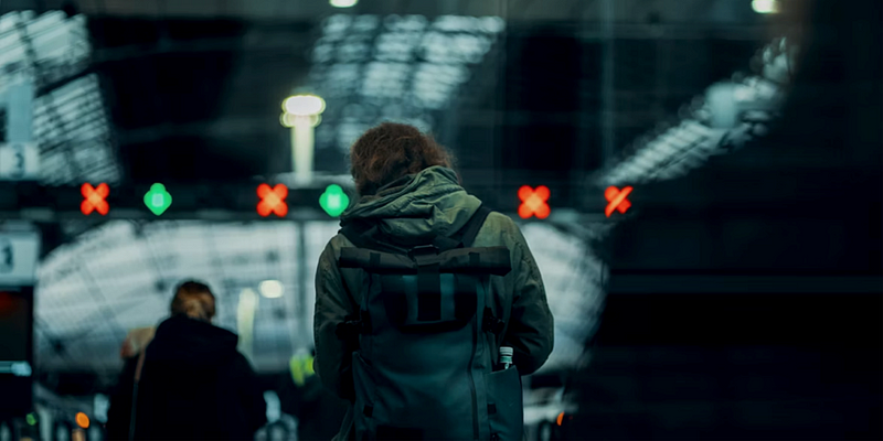 Passenger walking through a railway station